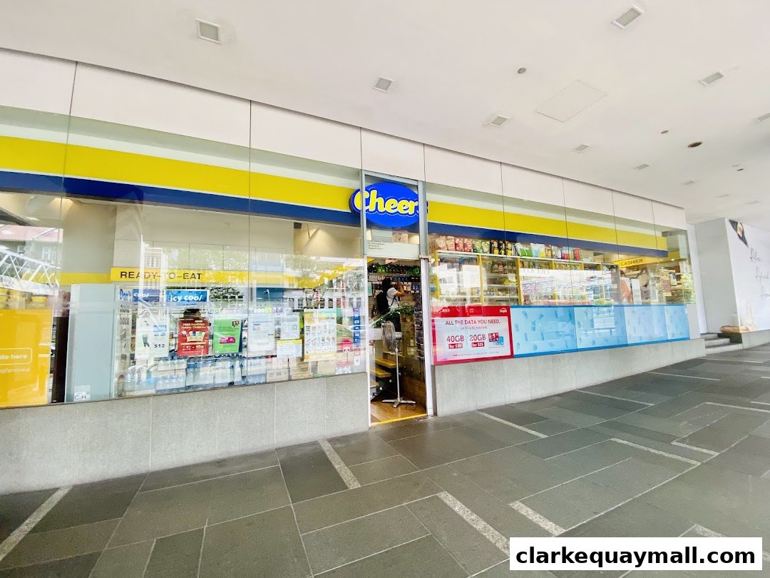 The exterior of a Cheers convenience store, also a DHL Express Service Point, with products visible inside.