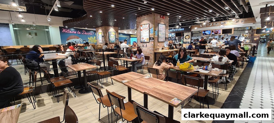 Interior view of a busy DON DON DONKI restaurant with many diners seated at tables.