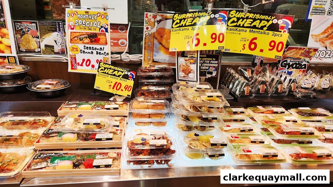 A display of pre-packaged Japanese food items including bentos, onigiri, and gyoza.