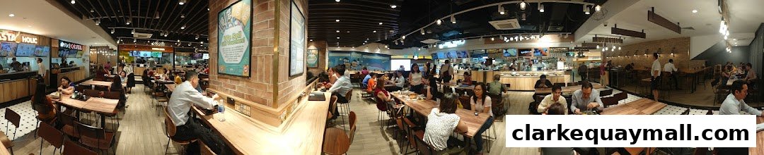 Interior view of a bustling DON DON DONKI food court with many diners and food stalls.