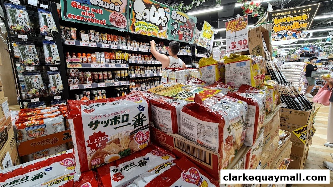A wide selection of instant noodles and sauces are displayed in a brightly lit supermarket aisle.