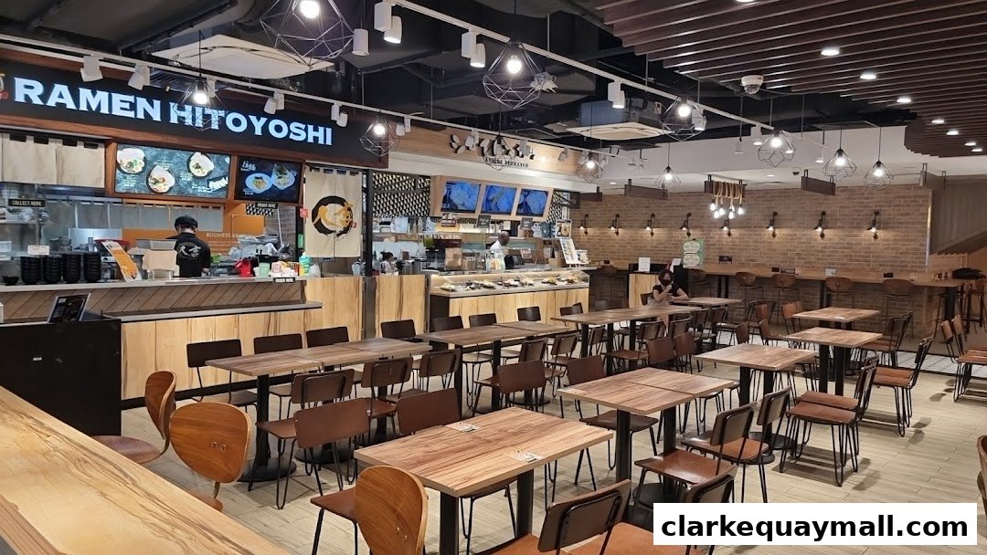 Interior of a ramen restaurant with seating and a counter.