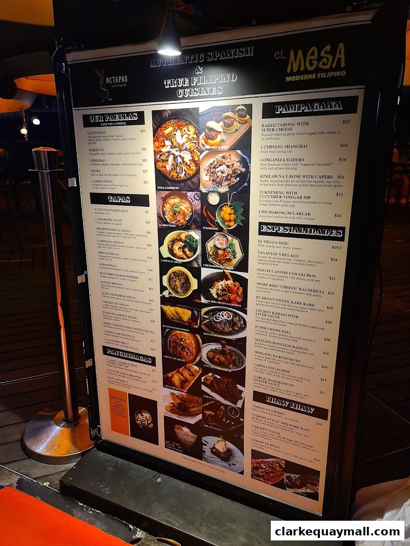 A menu board displaying authentic Spanish and Filipino cuisines with vibrant food photography.