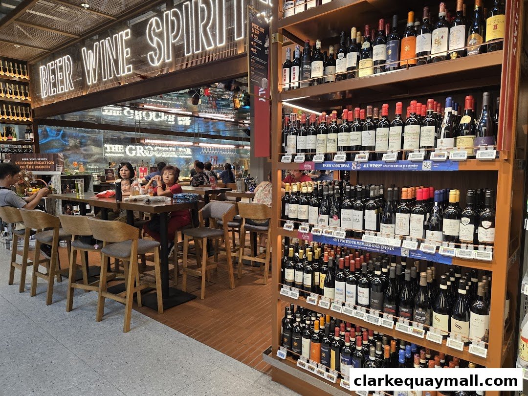 A well-stocked wine and spirits section with a seating area for customers.