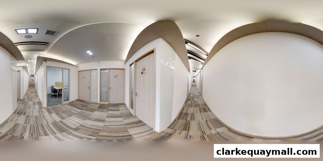 A panoramic view of a modern office hallway with multiple doors and a carpeted floor.