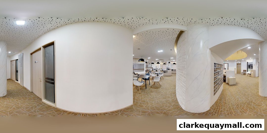 Interior view of a modern hospitality management office with seating areas and reception.
