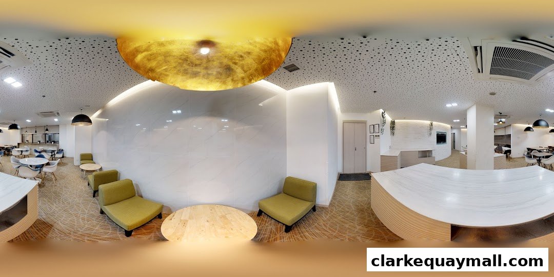 Interior view of a modern lounge area with seating, tables, and decorative ceiling elements.