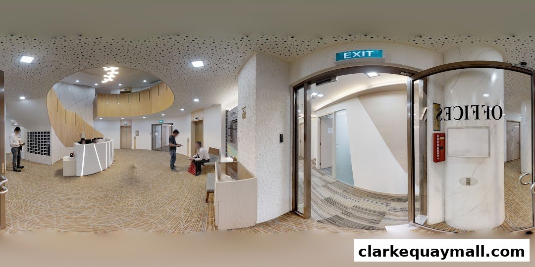 Modern office reception area with a curved desk, staircase, and an 'Office' entrance.