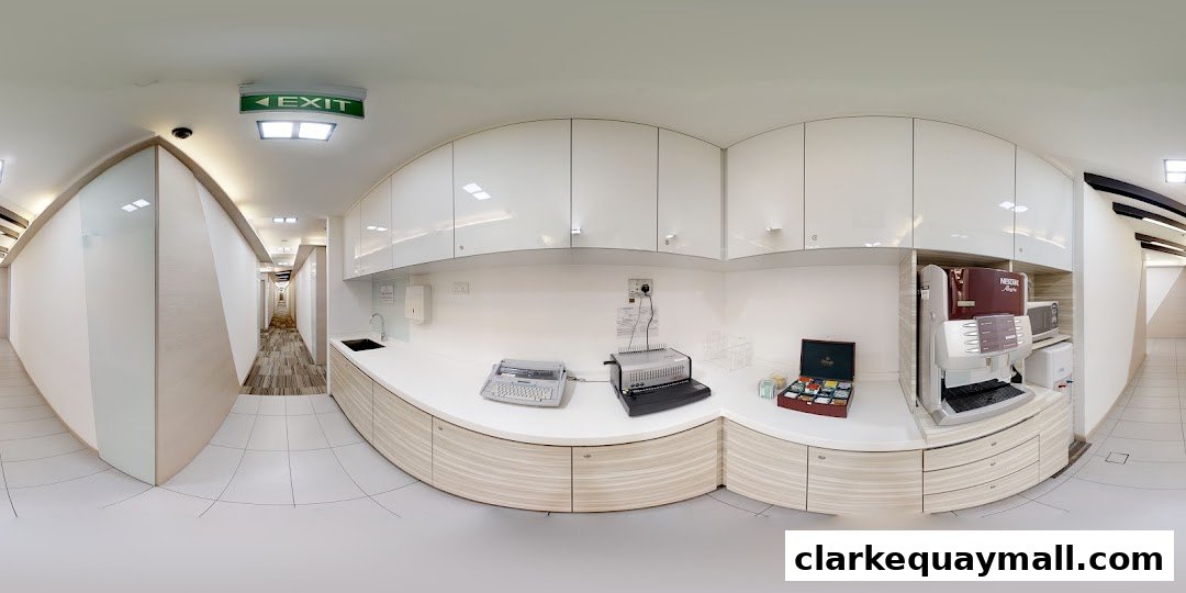 A clean, modern pantry area with white cabinets, a coffee machine, and a hallway.