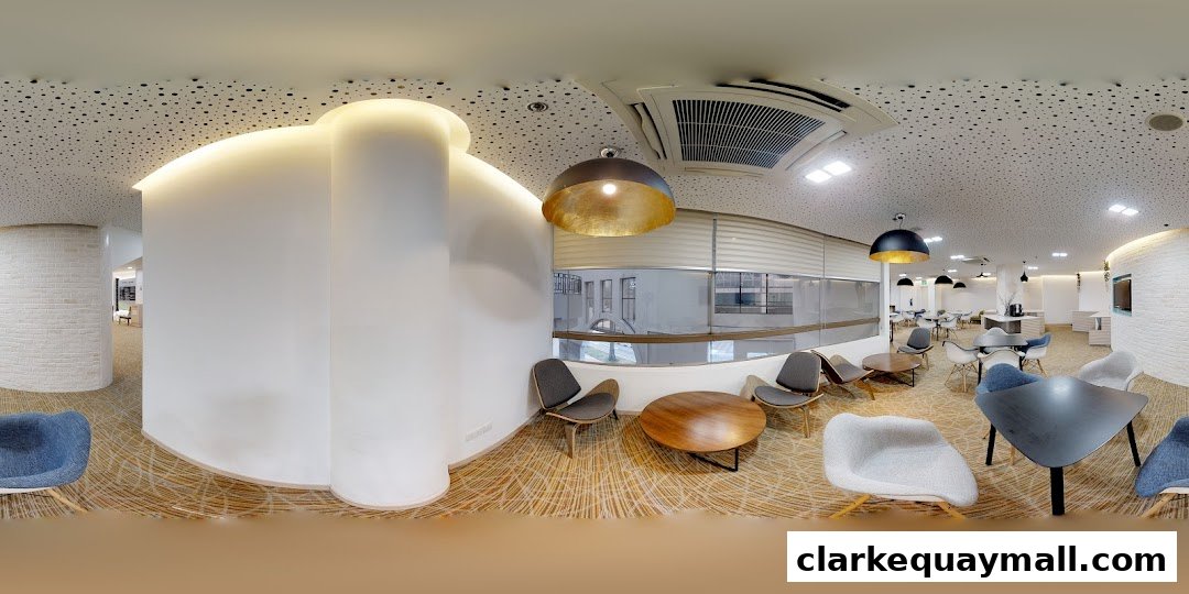 Modern lounge area with stylish chairs, tables, and unique pendant lighting.