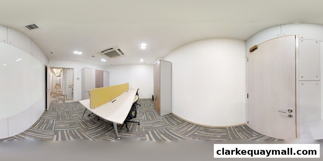 Modern office interior with workstations, storage cabinets, and a hallway.