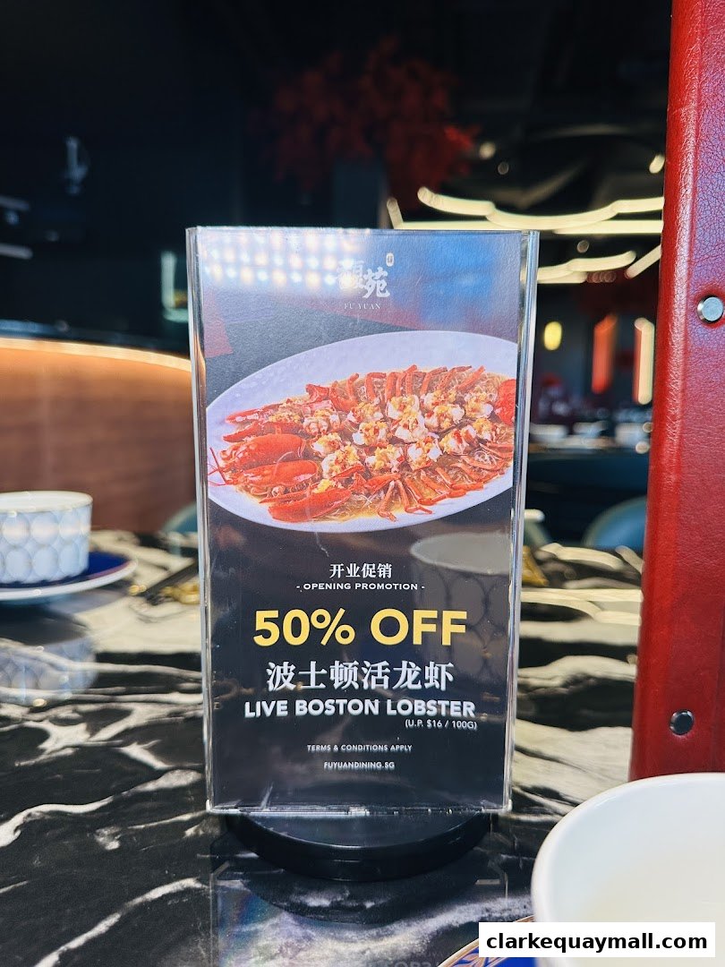 A promotional sign for 50% off live Boston lobster at Fu Yuan Teochew Dining.