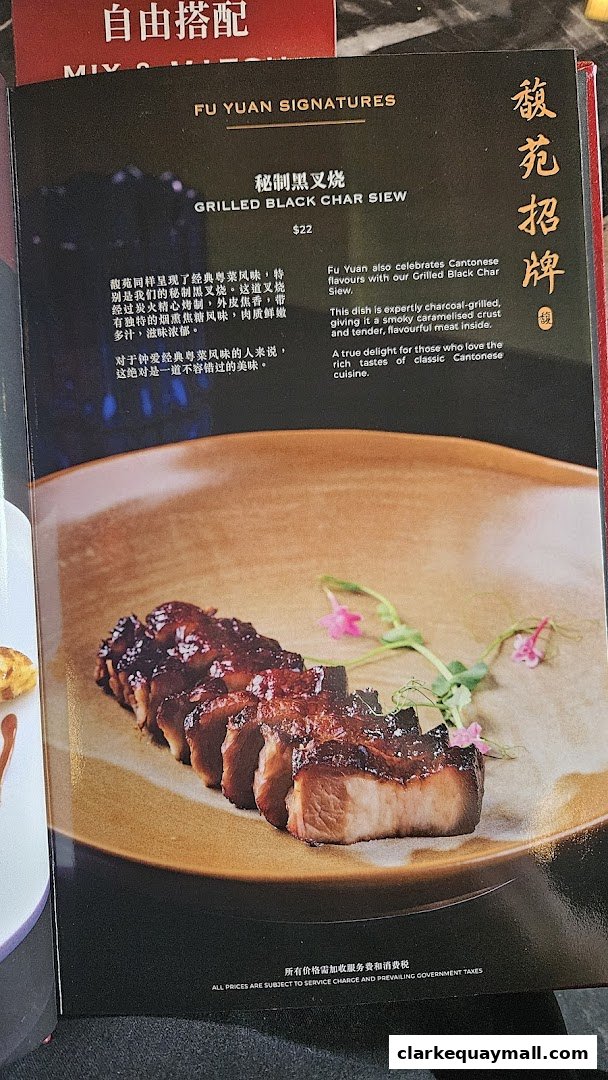 A close-up of a menu item featuring grilled black char siew with descriptive text.