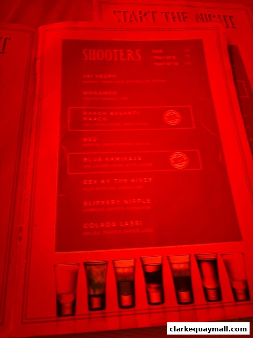 A menu page from Gabbar Bistro Bar featuring a list of 'Shooters' and colorful shots.