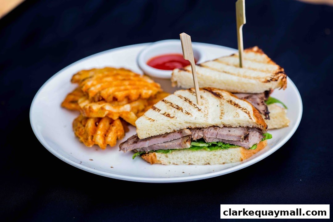 A plate of grilled sandwiches with waffle fries and a side of ketchup.