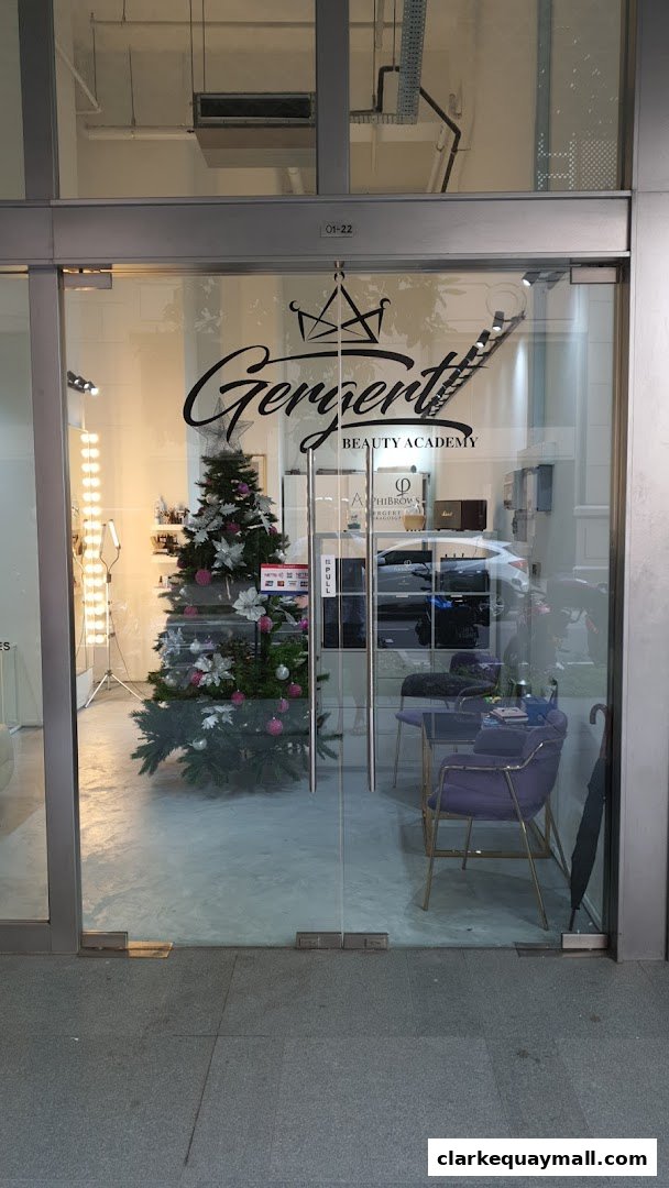 The entrance to Gergert Beauty Academy, featuring a Christmas tree and salon interior.