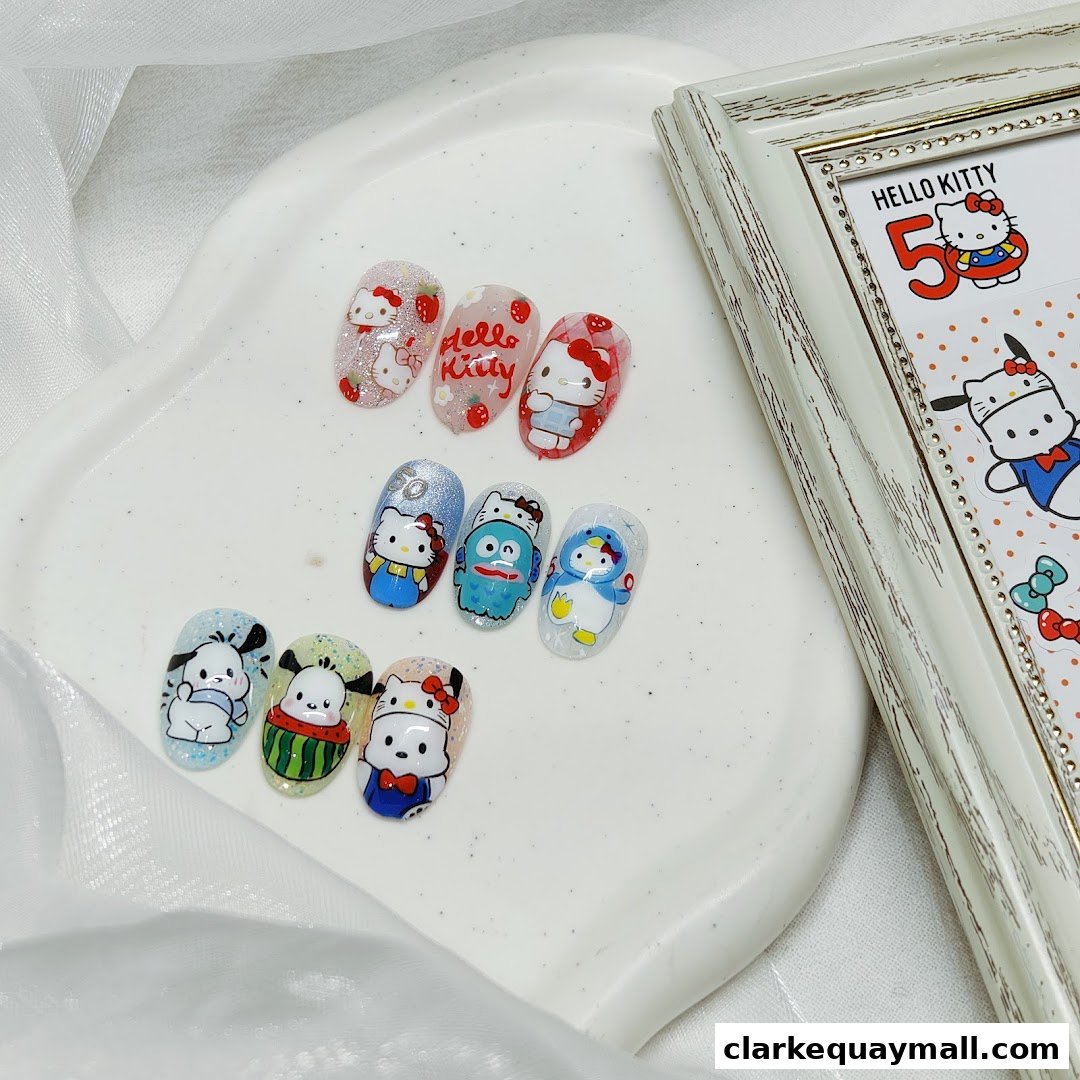 Nail art designs featuring Hello Kitty and other cartoon characters on display.