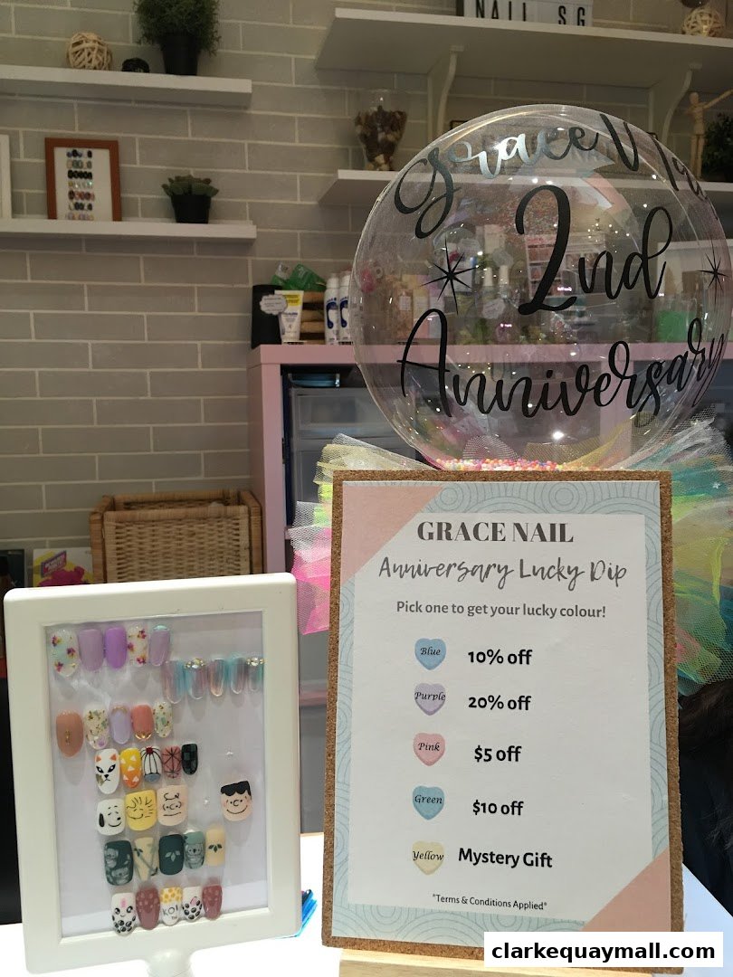 Grace Nail Salon displays nail art samples and an anniversary lucky dip promotion.