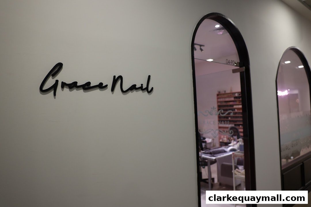 The entrance to Grace Nail Salon with its name displayed on the wall.