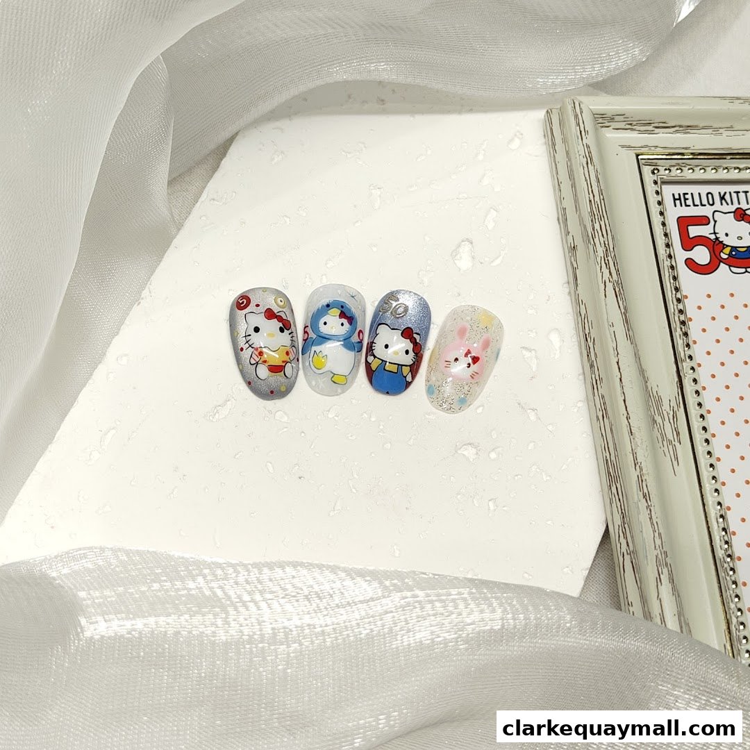 Four nail art designs featuring Hello Kitty characters and a bunny, displayed on a white surface.