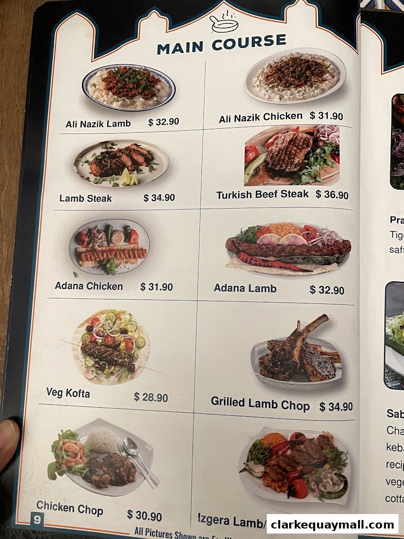 A menu page showcasing various main course dishes with enticing images and prices.