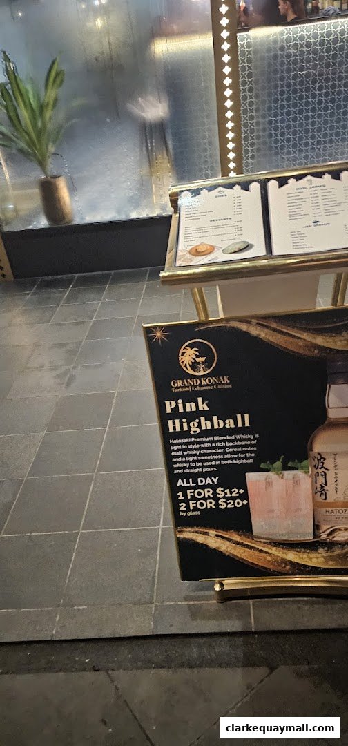 A sign advertising a Pink Highball drink from Grand Konak Turkish and Lebanese Cuisine.