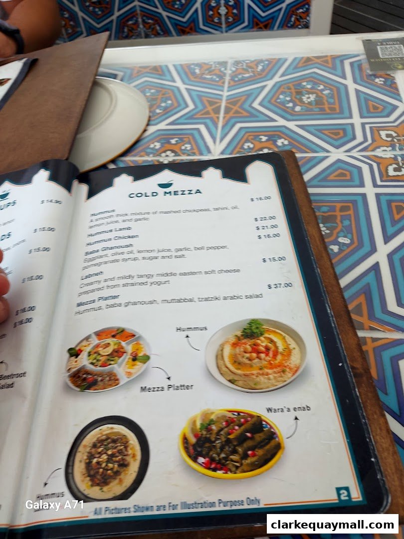 A menu from Grand Konak Turkish and Lebanese Restaurants featuring cold mezze dishes with images.