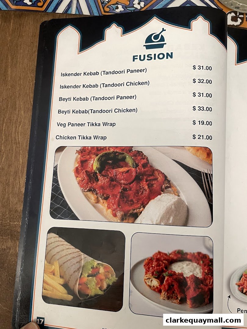 A menu page from Grand Konak Turkish and Lebanese Restaurants featuring fusion dishes.