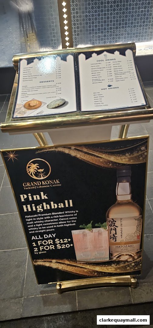 A sign advertising Grand Konak's Pink Highball with Hatozaki whisky.