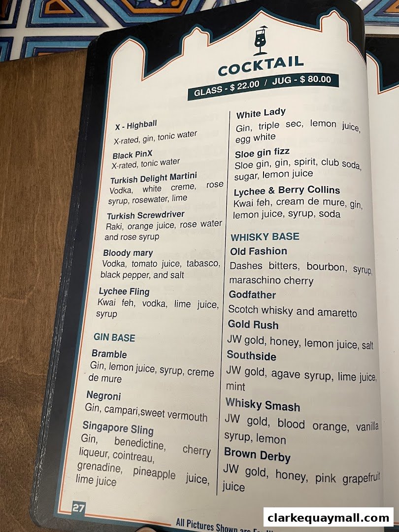A menu page displaying various cocktails with their ingredients and prices.