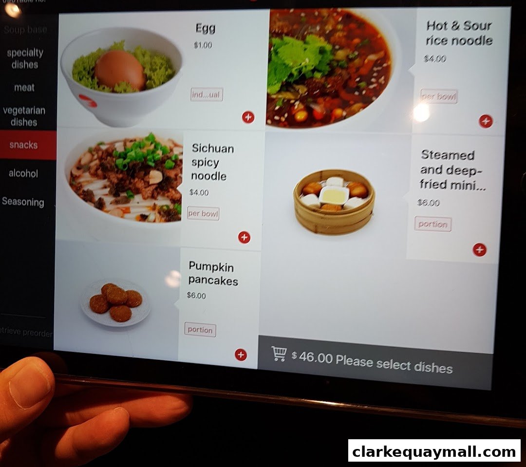 A tablet screen displaying a menu of hot pot dishes with images and prices.