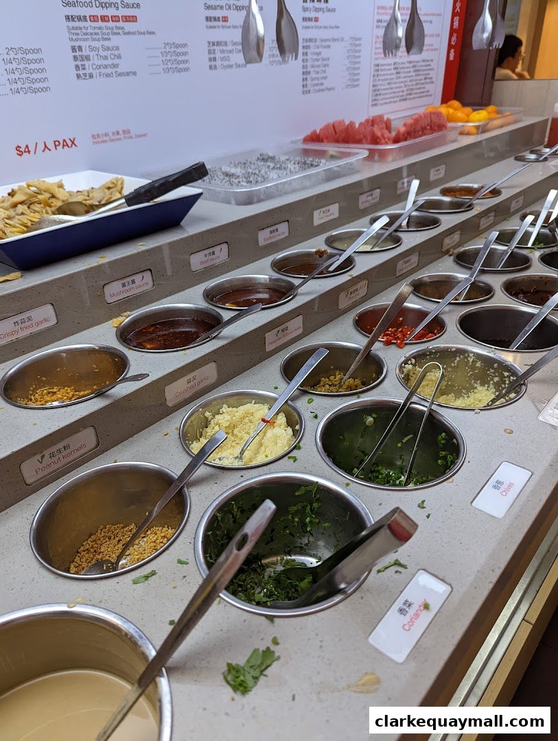 A selection of dipping sauces and ingredients for hot pot.
