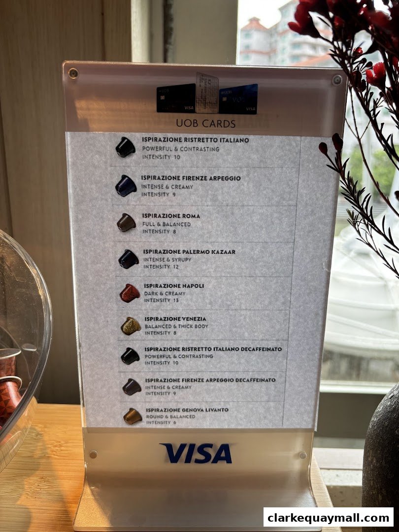 A menu displaying various coffee capsule flavors with intensity ratings and descriptions.