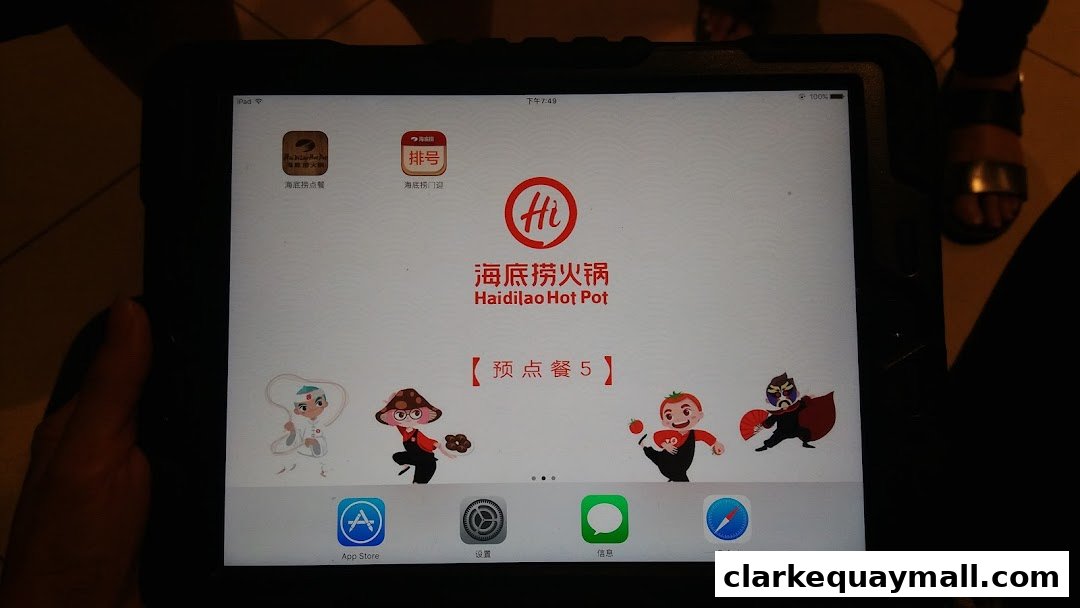 A tablet displaying the Haidilao Hot Pot app with cartoon characters and ordering options.