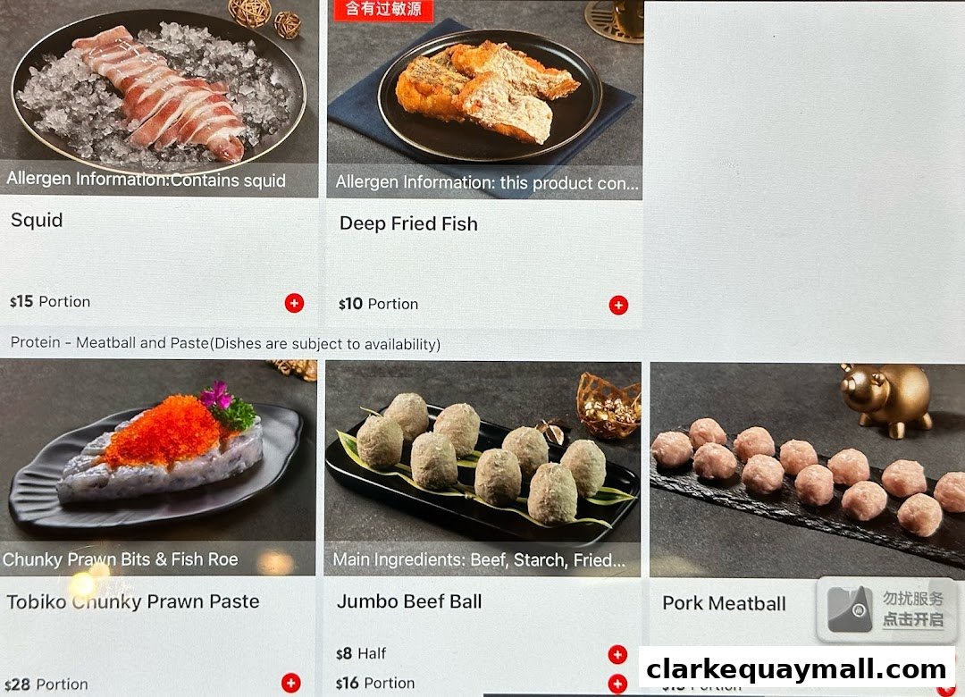 A menu display showing various hot pot ingredients like squid, fish, and meatballs.