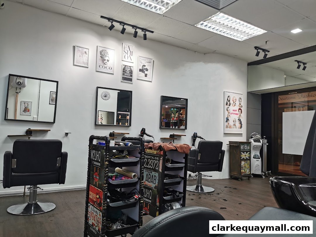 Interior of a modern hair salon with styling chairs, mirrors, and decorative art.