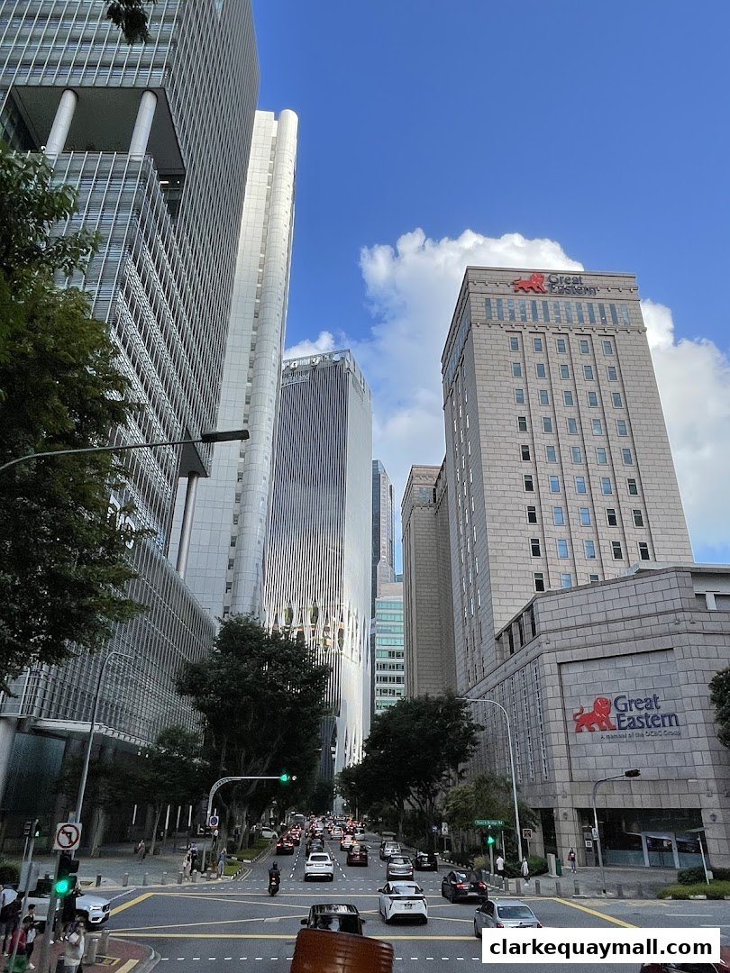 A street view of modern skyscrapers and traffic in a city.