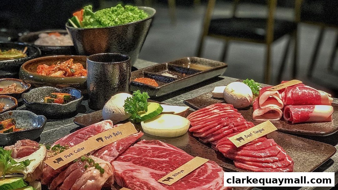 A spread of raw meats, kimchi, and side dishes for Korean BBQ.