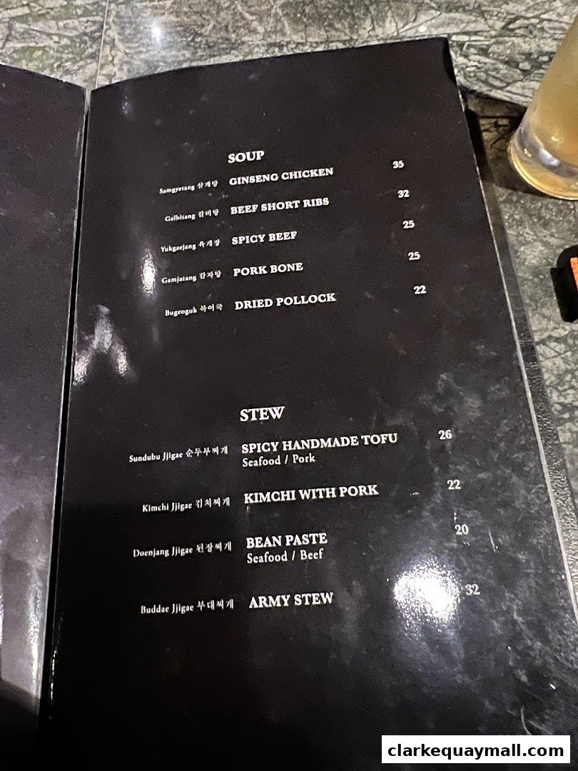 A menu from Hanjip Korean Grill House featuring soups and stews with prices.