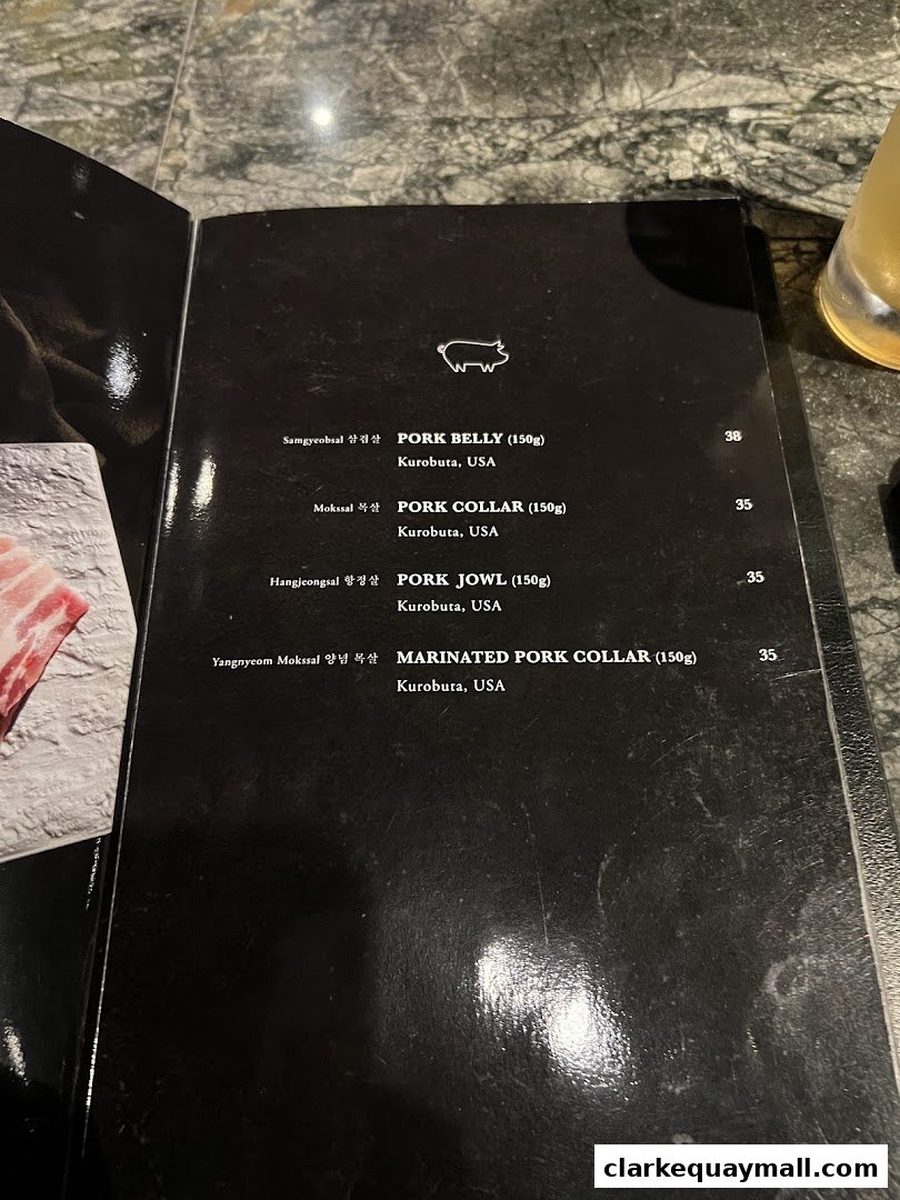 A menu from Hanjip Korean Grill House featuring various pork cuts and their prices.