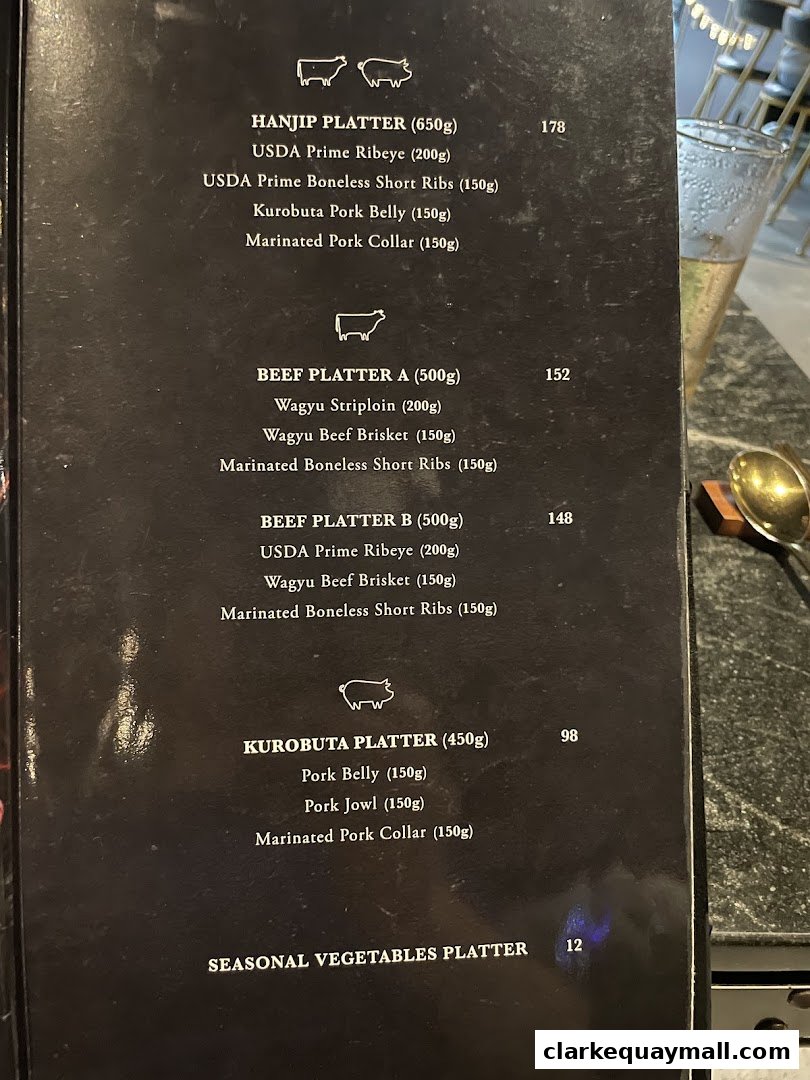 A menu from Hanjip Korean Grill House featuring various meat platters and prices.