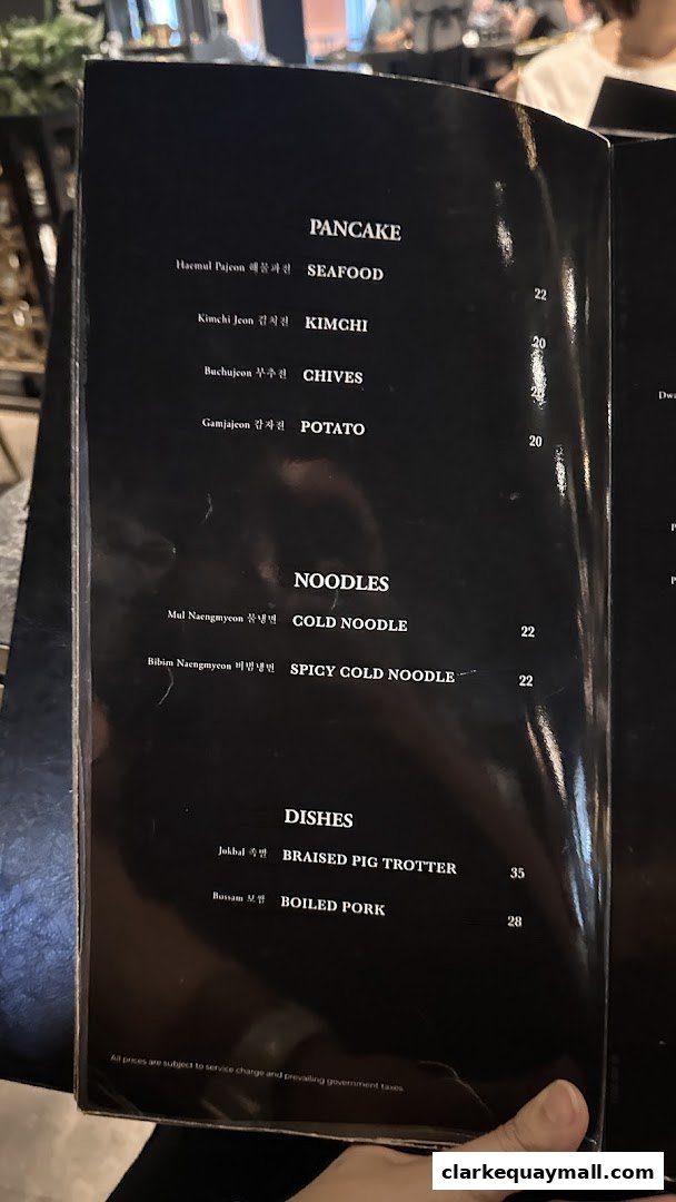 A menu from Hanjip Korean Grill House featuring pancakes, noodles, and dishes.