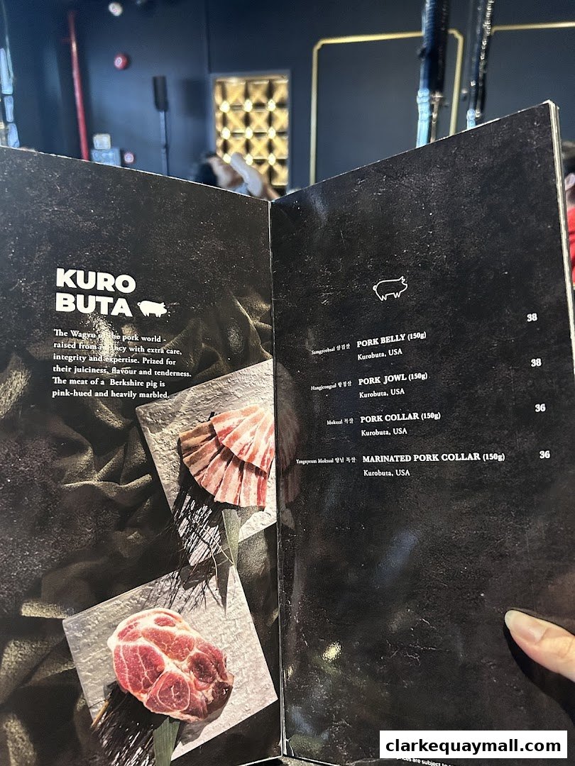 A menu page showcasing Kuro Buta pork dishes with descriptions and prices.