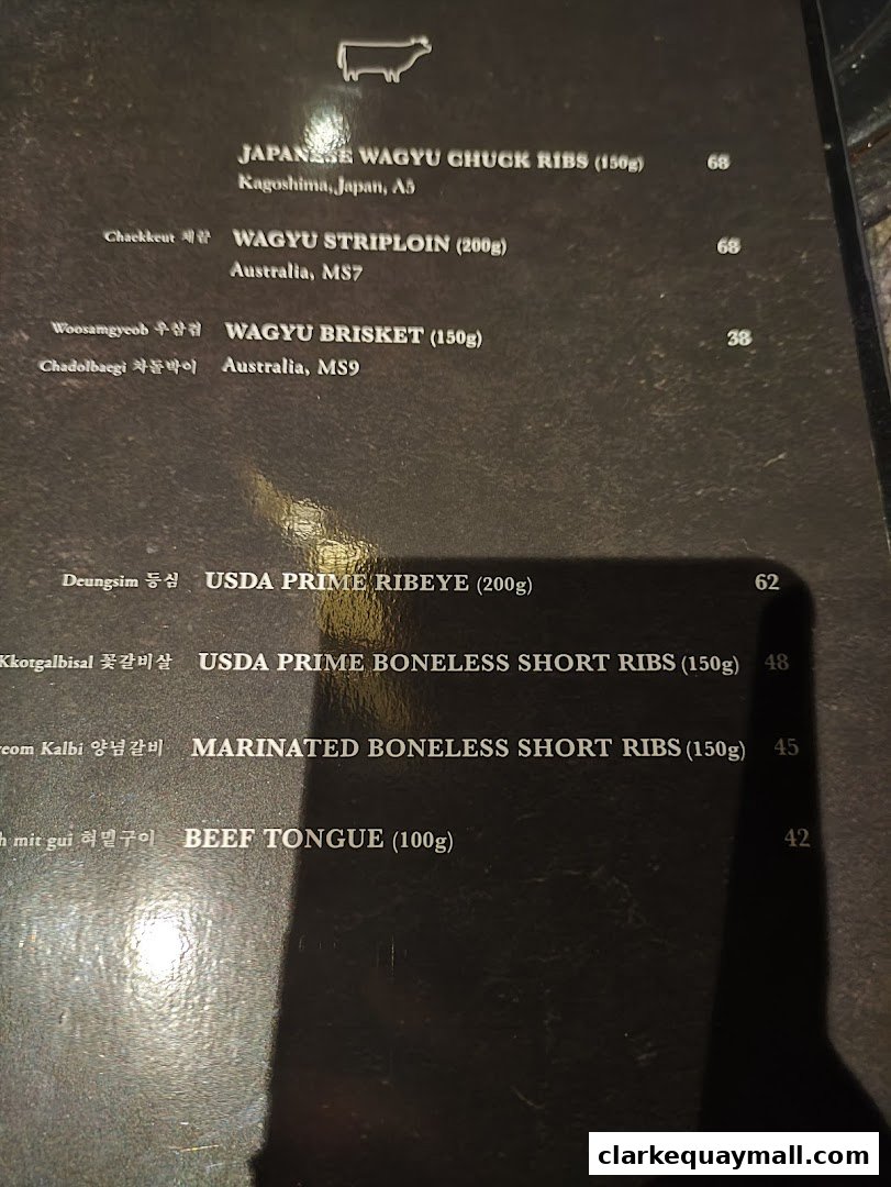A menu from Hanjip Korean Grill House featuring various cuts of Wagyu and USDA Prime beef.