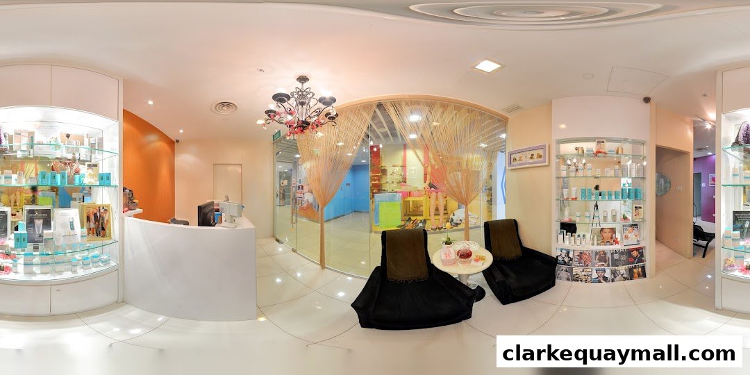 Interior view of a modern beauty salon with product displays and seating area.