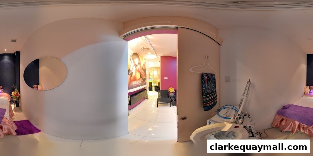 Interior view of a wellness and beauty salon with treatment beds and equipment.
