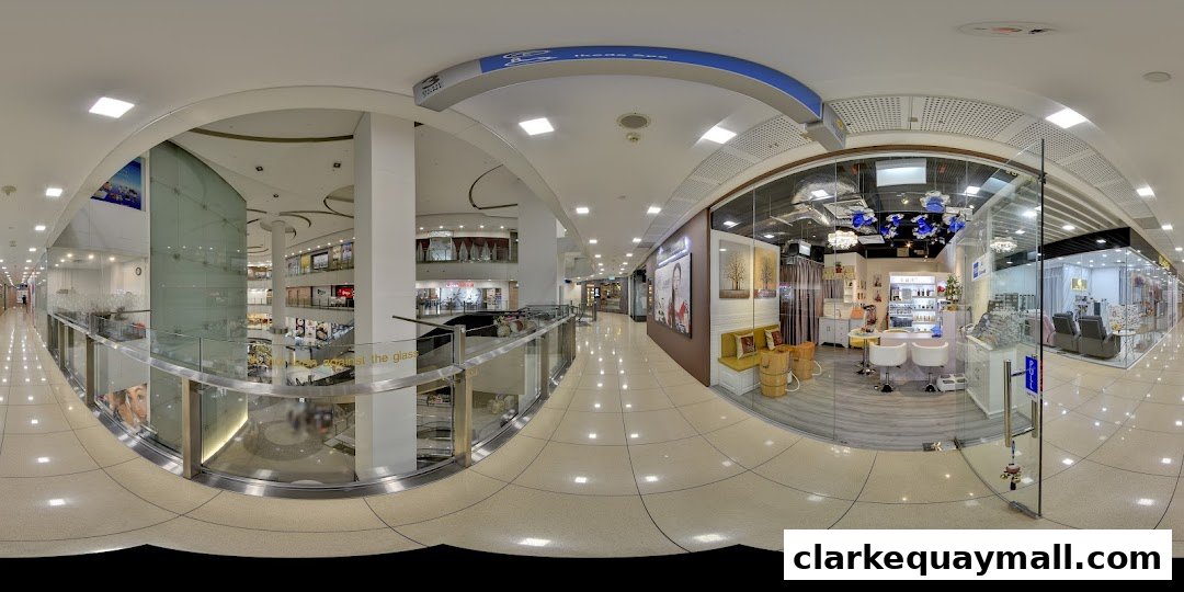 A panoramic view of a modern shopping mall interior, showcasing a beauty salon.