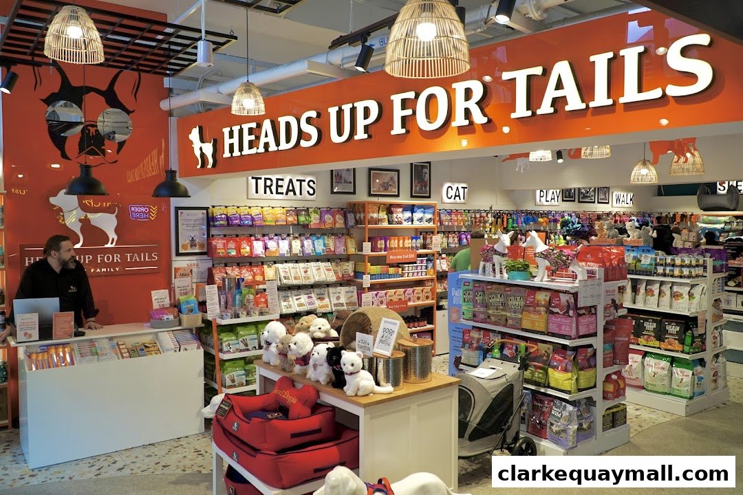 Interior of a pet supply store with shelves stocked with pet food, treats, and accessories.