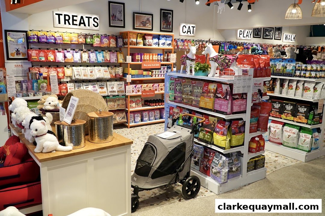 Interior view of a pet supply store with shelves stocked with pet food, treats, and accessories.