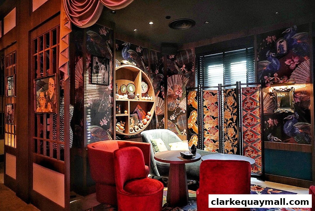 Luxurious speakeasy lounge with plush red seating and ornate peacock-themed wallpaper.